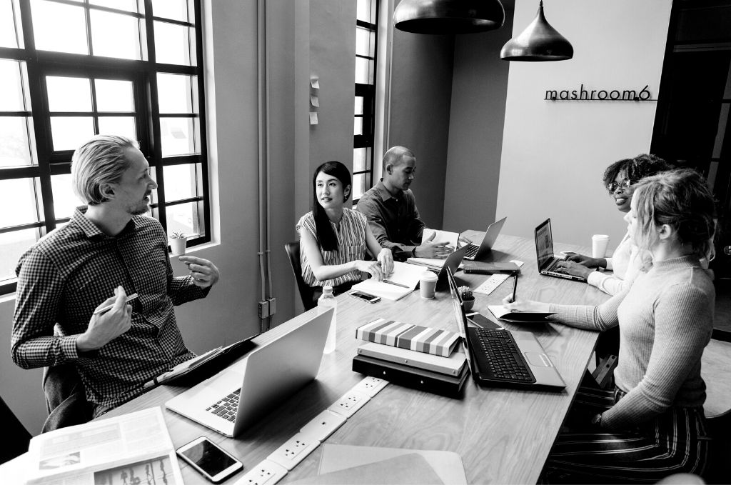 Team Lead with his team around table